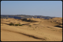 Blick von den Sanddünen zum normalen Land